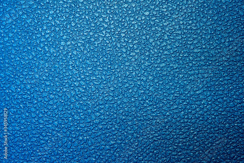 Close-up scene of etching surface texture background in the blue scene. The rough texture background sample for etching process.