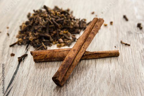 Wallpaper Mural cinnamon and cloves on a wooden background. Close-up. Torontodigital.ca