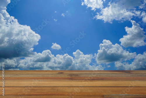 Wooden floor and blue sky background.