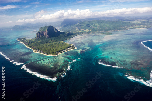 Fototapeta Naklejka Na Ścianę i Meble -  Incredible view of the famous underwater waterfall in Mauritius. Picture taken from helicopter