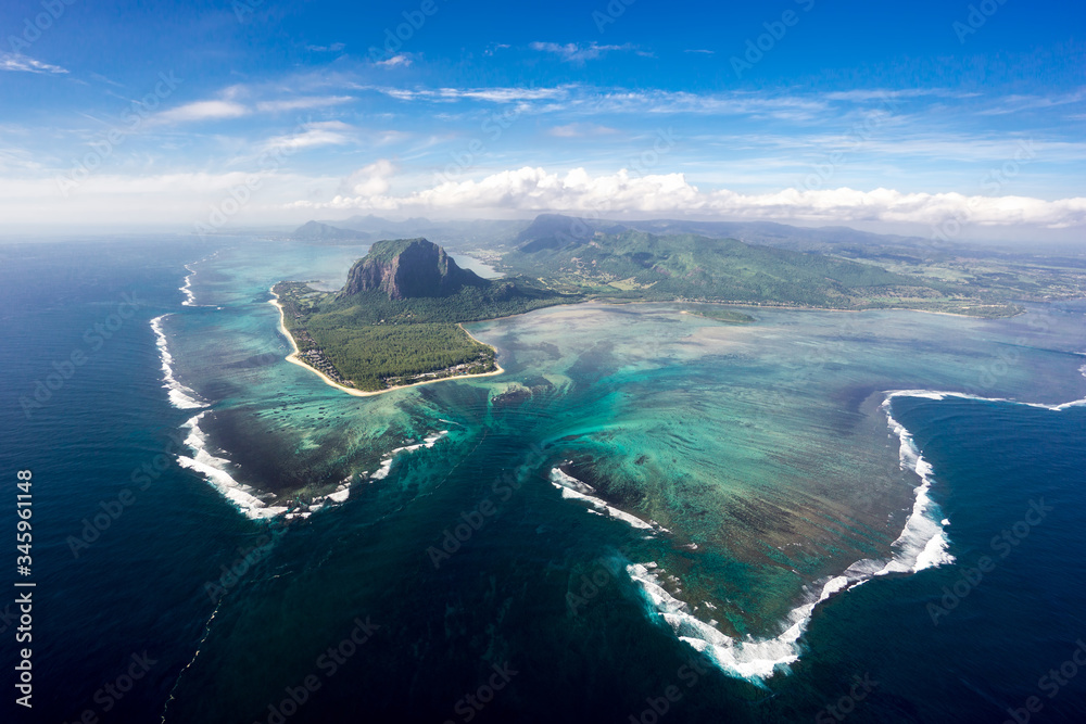Incredible view of the famous underwater waterfall in Mauritius. Picture taken from helicopter - obrazy, fototapety, plakaty 