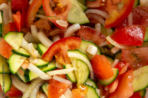 Fresh salad with tomatoes, cucumbers and onion.