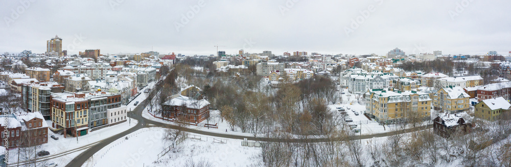 Panorama of the Kirov city and and Razderikhinsky ravine in the central part of the city of Kirov on a winter day from above. Russia from the drone.