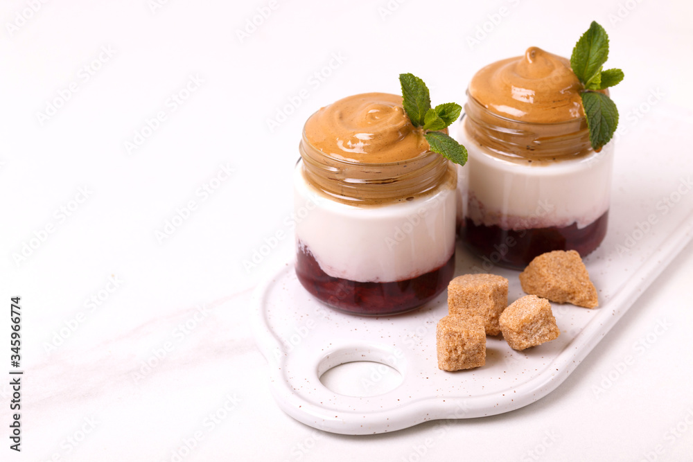 berry dalgona coffee desset with cherry, yogurt. trendy South Korean cold drink berry dalgona coffee desset with cherry, yogurt. trendy South Korean cold drink
