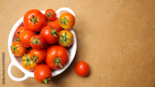 tomatoes on brown background. Top view, Copy space for the ads