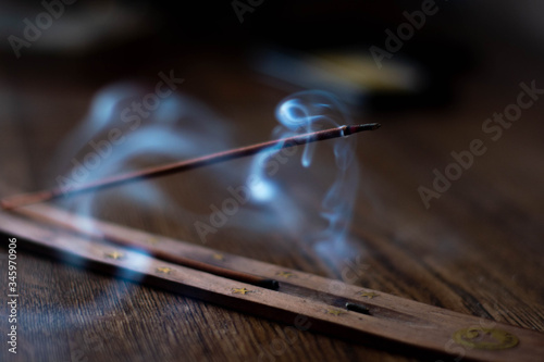 Incense sticks and smoke from burning incense. A wonderful smoke. Blurred background.