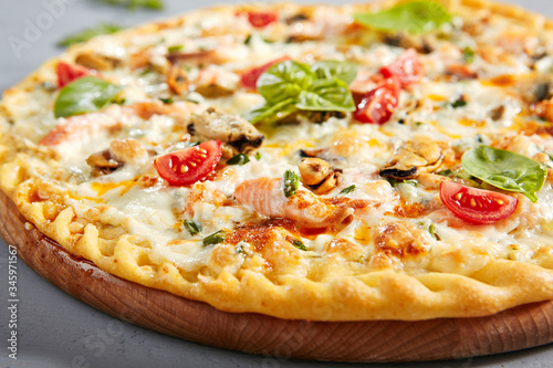 Seafood pizza on wooden board