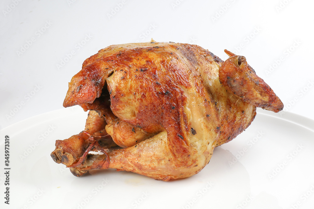 Whole roasted grilled chicken poultry bird on white background Whole roasted grilled chicken poultry bird on white background