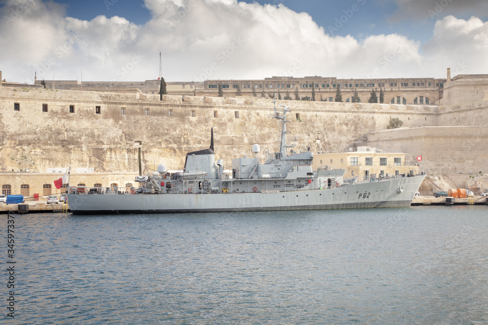 warship moored up on the bank warship moored up on the bank