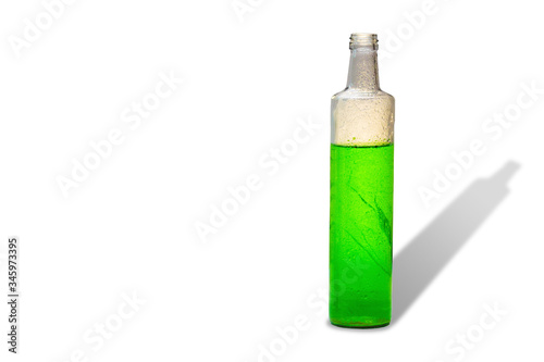 glass bottle with green refreshing herbal drink antioxidant isolated