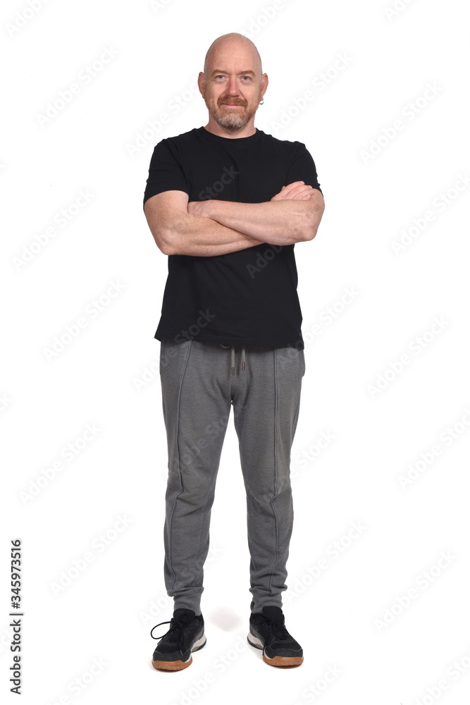 man with sportswear and arms crossed on white background man with sportswear and arms crossed on white background