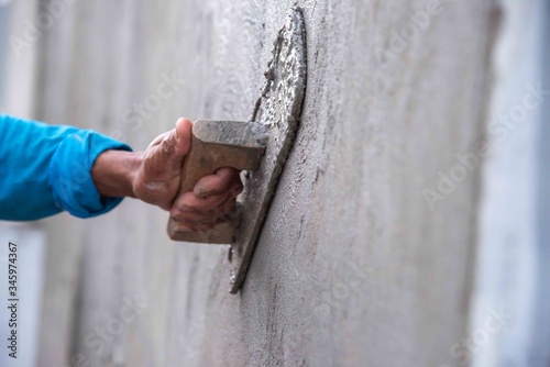 mason rural thailand Plastering concrete to build wall background industrial worker with plastering tools renovating house concept quality