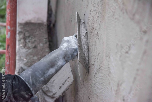 mason rural thailand Plastering concrete to build wall background industrial worker with plastering tools renovating house concept quality