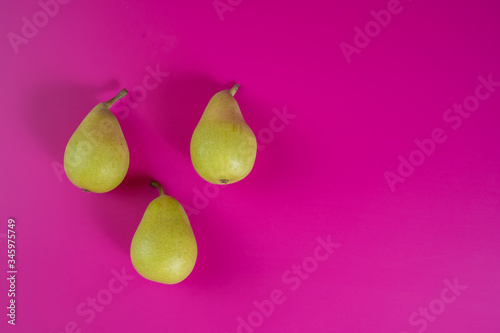 green pears on background