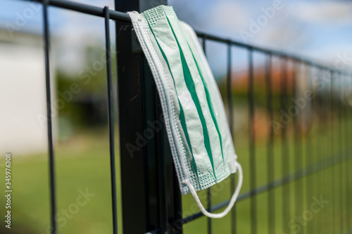 Mask ist hanging on a fence