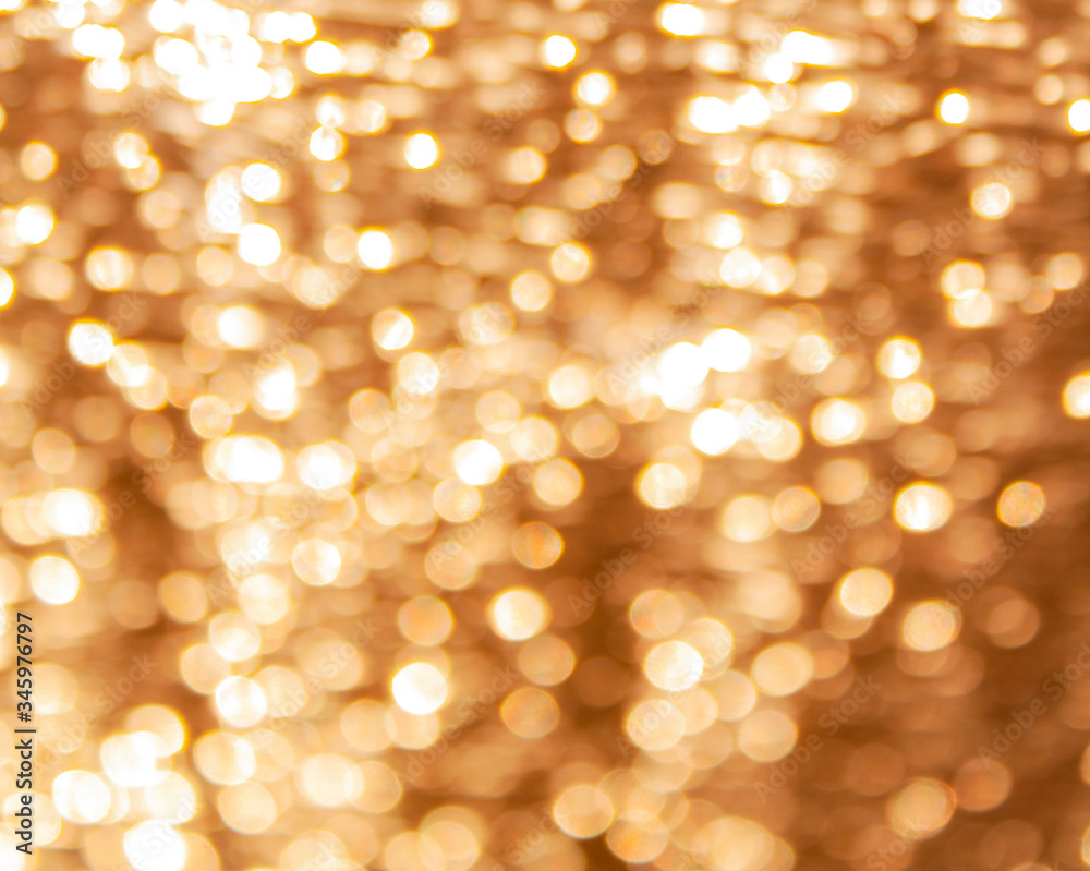 background with a golden glow and bokeh from a foil of a building insulation background with a golden glow and bokeh from a foil of a building insulation