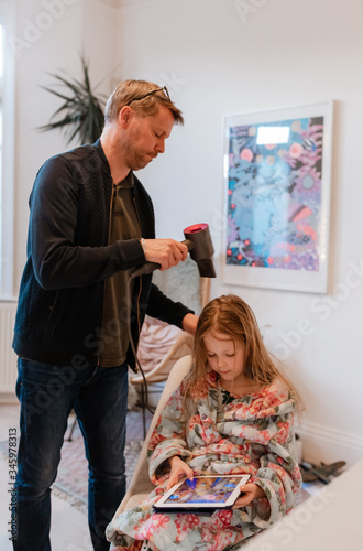 Wallpaper Mural father drying little girl hair with dryer Torontodigital.ca
