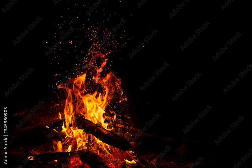 Bonefire with sparks on black with free space Bonefire with sparks on black with free space