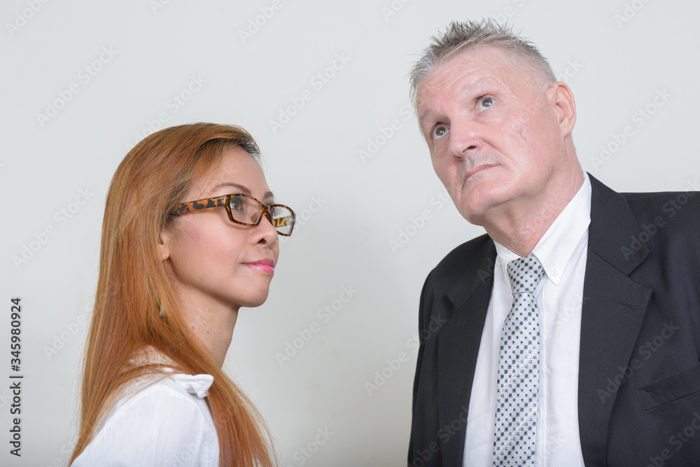 Mature multi ethnic business couple working together Mature multi ethnic business couple working together