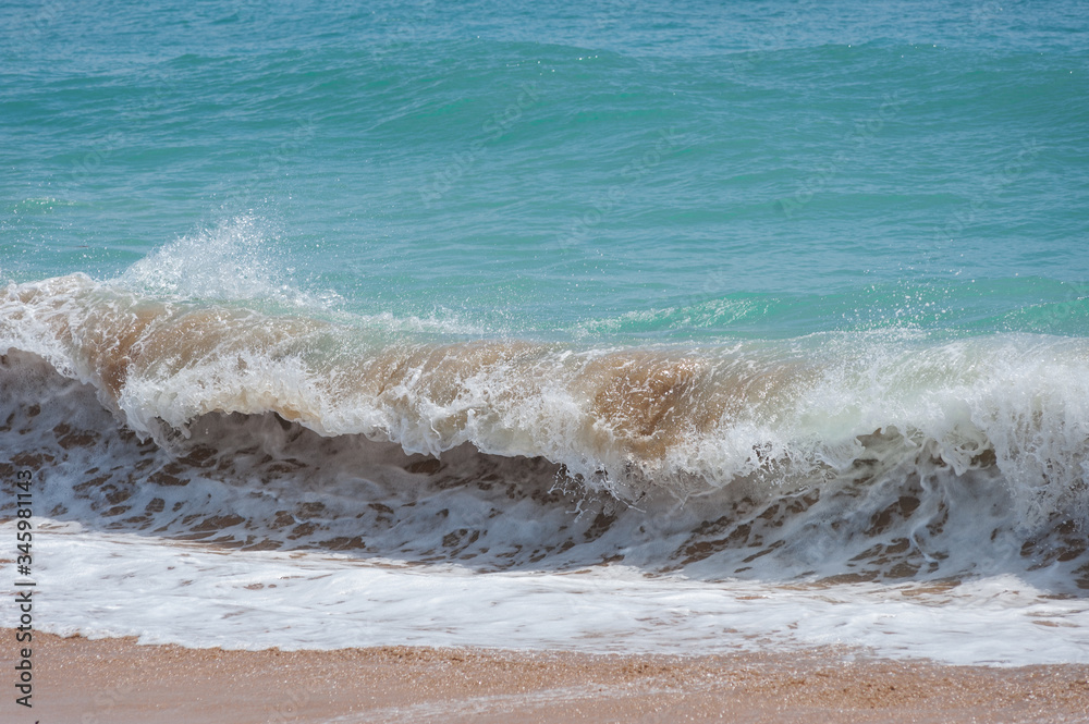 Ocean waves on a sandy beach.