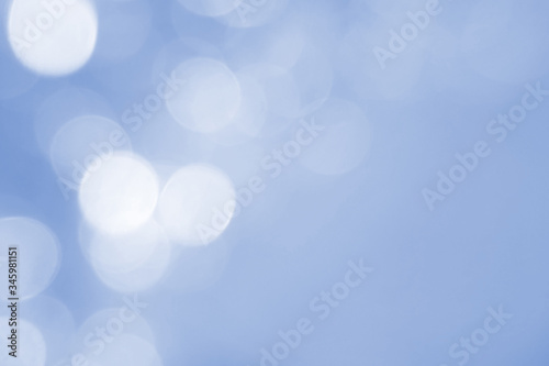 Abstract blue bokeh background. Defocused pattern for advertising, newspaper, magazine design. Universal. Soft, season, texture, color, winter, blue lights. copy space