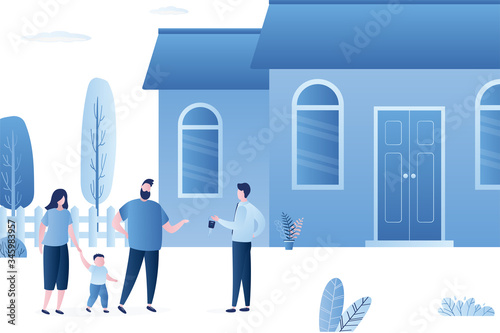 Handsome owner gives the key to new tenants or home buyers. Family rents or buys real estate.