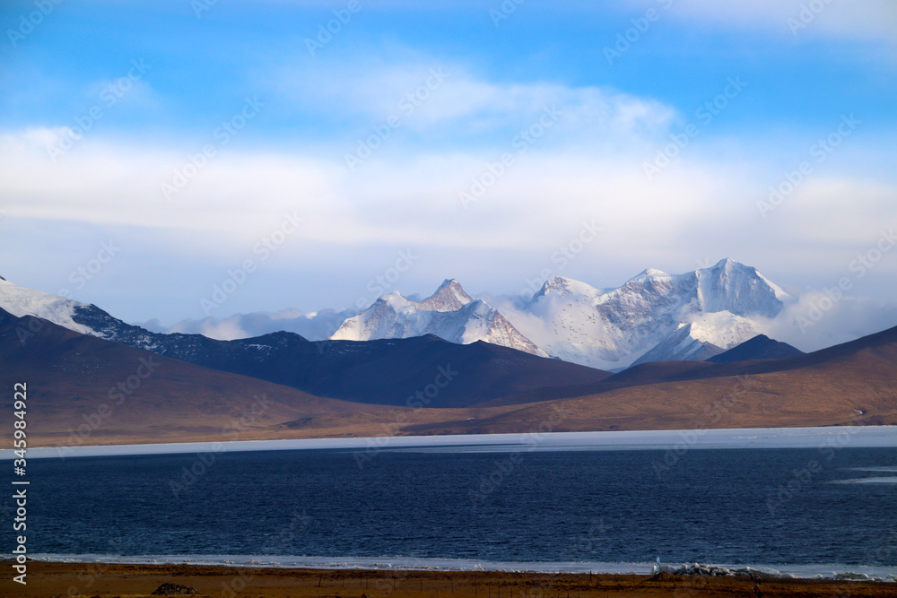 Ice lake, snow mountain, brown distant mountain, gorgeous cloud, a plateau beauty
