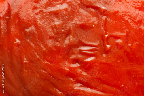 Tomato sauce ketchup texture background close up © Piman Khrutmuang