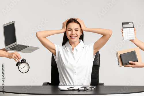 Stressed young secretary wi...
