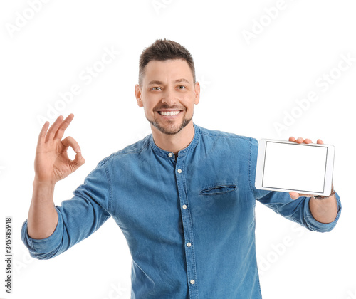 Handsome man with tablet co...