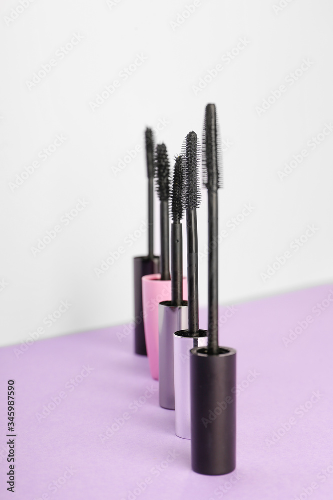 Black mascara on color background Black mascara on color background
