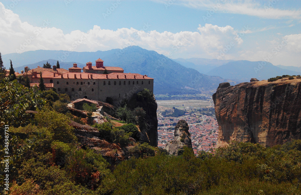 Landscape in Meteora. Greece.
View of the Monastery of Saint Stephen, in the rear the city of Kalambaka and Balcans mountain chain.