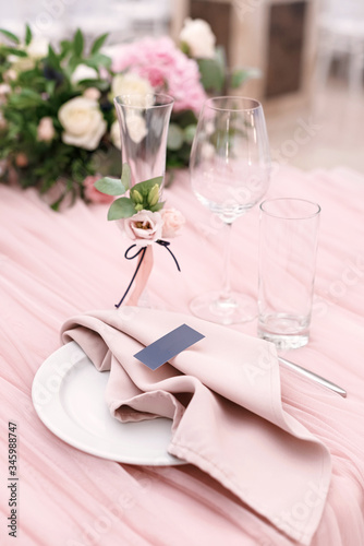 Fototapeta Luxurious wedding table decoration for reception of guests with stylish napkins,