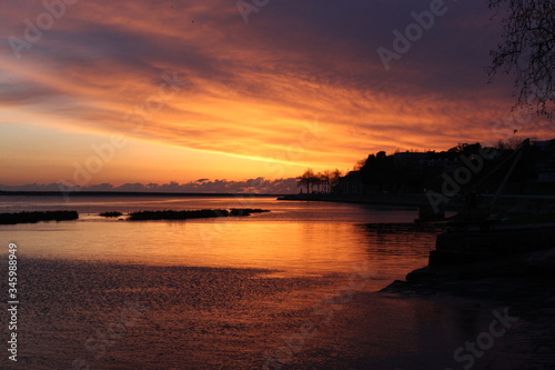 Sunset at the ocean, silhouettes, natural colors
