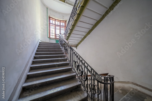 empty entrance in apartment building stairwell stairs