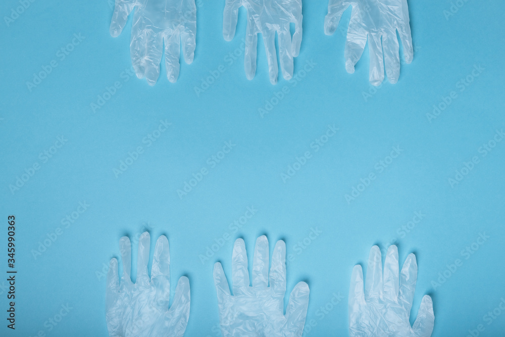 Whitte surgical gloves isolated on the blue background. Concept protect against infection or contamination
