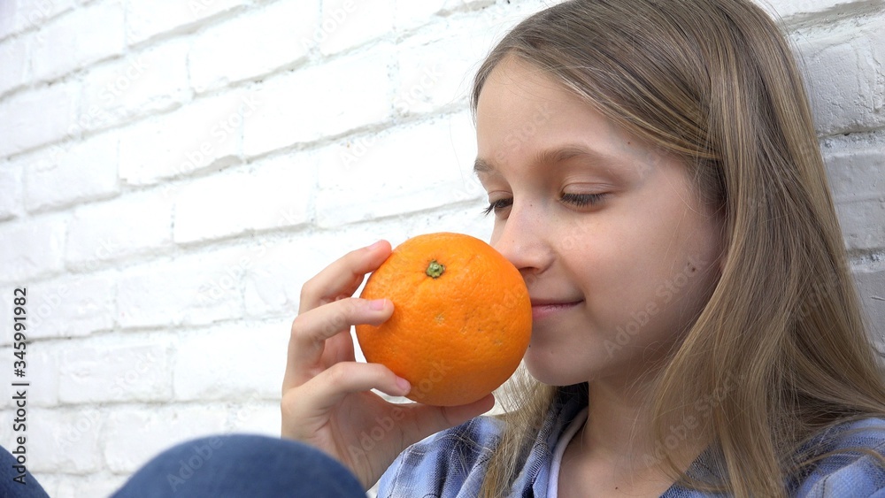 Child Eating Oranges Fruits at Breakfast, Girl Kid Smelling Healthy Food Kitchen Child Eating Oranges Fruits at Breakfast, Girl Kid Smelling Healthy Food Kitchen
