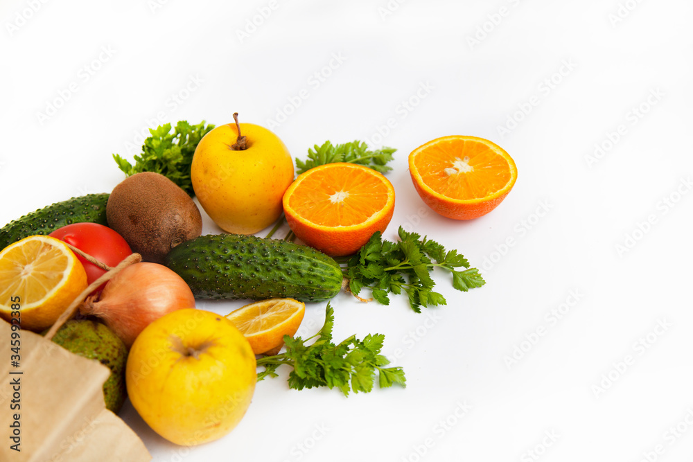 Set of food products on a white background. A paper bag delivers a quarantine food crisis. Food Delivery, Donation, Coronavirus. Fresh vegetables, fruits. Soft focus. Set of food products on a white background. A paper bag delivers a quarantine food crisis. Food Delivery, Donation, Coronavirus. Fresh vegetables, fruits. Soft focus.
