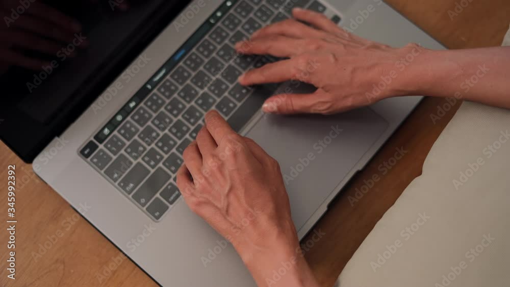 Woman hands from above typing fast on laptop computer keyboard Girl writing message in social networks Browsing shopping online Woman hands from above typing fast on laptop computer keyboard Girl writing message in social networks Browsing shopping online