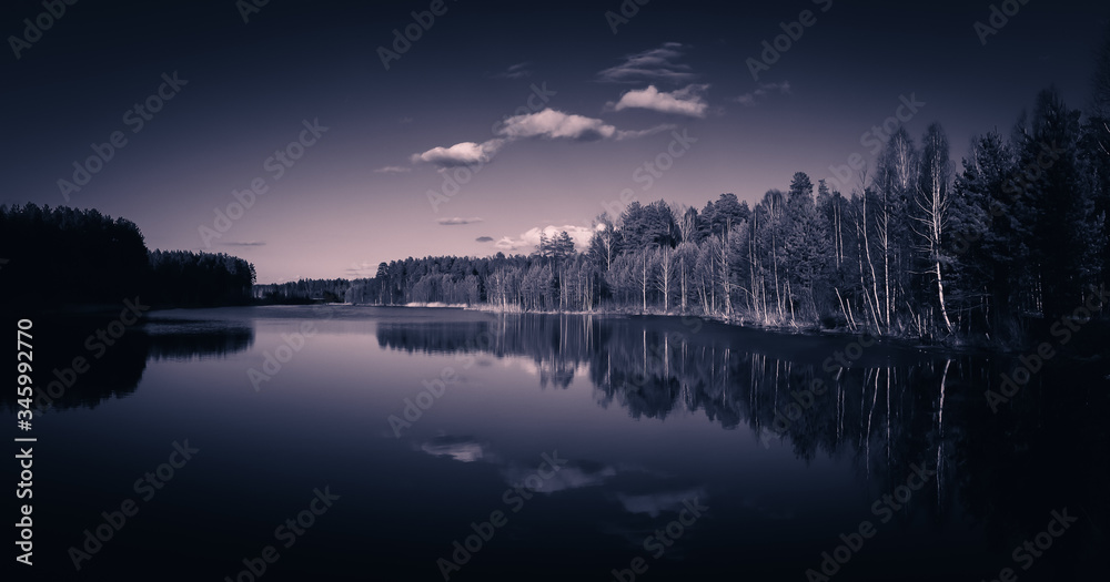 black and white landscape of a lake with a forest on the shore, Russia, Ural, may