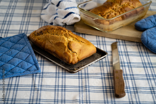 HOT HOME BREAD, ON A TABLE WITH TRADITIONAL TABLECLOTH