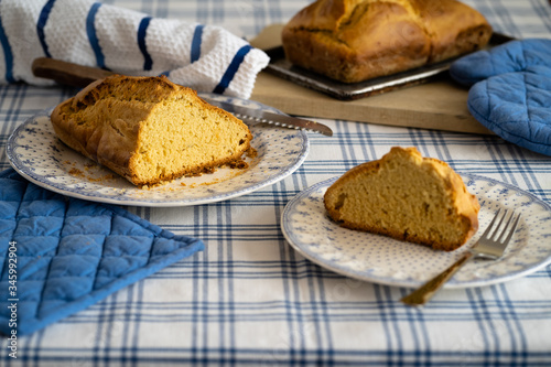 HOT HOME BREAD, ON A TABLE WITH TRADITIONAL TABLECLOTH