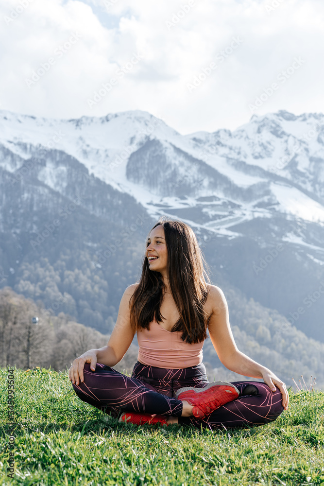 Woman doing yoga in the mountains sport