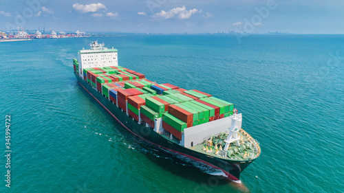 Aerial view container ship and boat going to sea port for logistics shipping