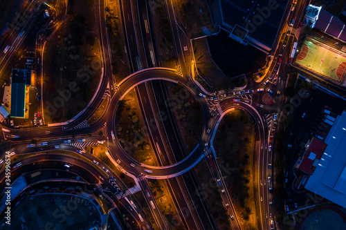 night highway and road interchanges shooting from a drone