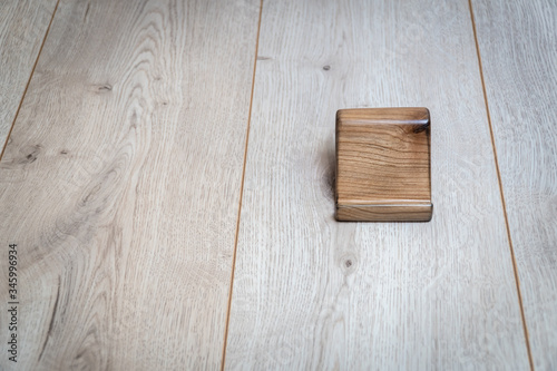 Wooden stand for phone on a wooden background