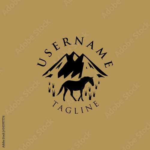 Logo of a horse farm in a vintage-style mountain area.
