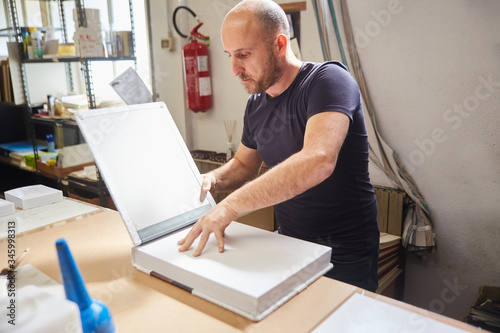 book binder working in a warehouse