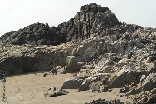 Rocks from volcanic rock on ocean beach