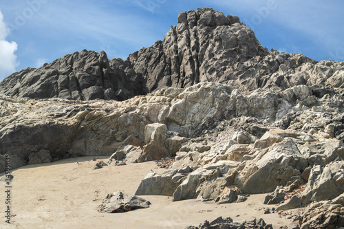 Rocks from volcanic rock on ocean beach